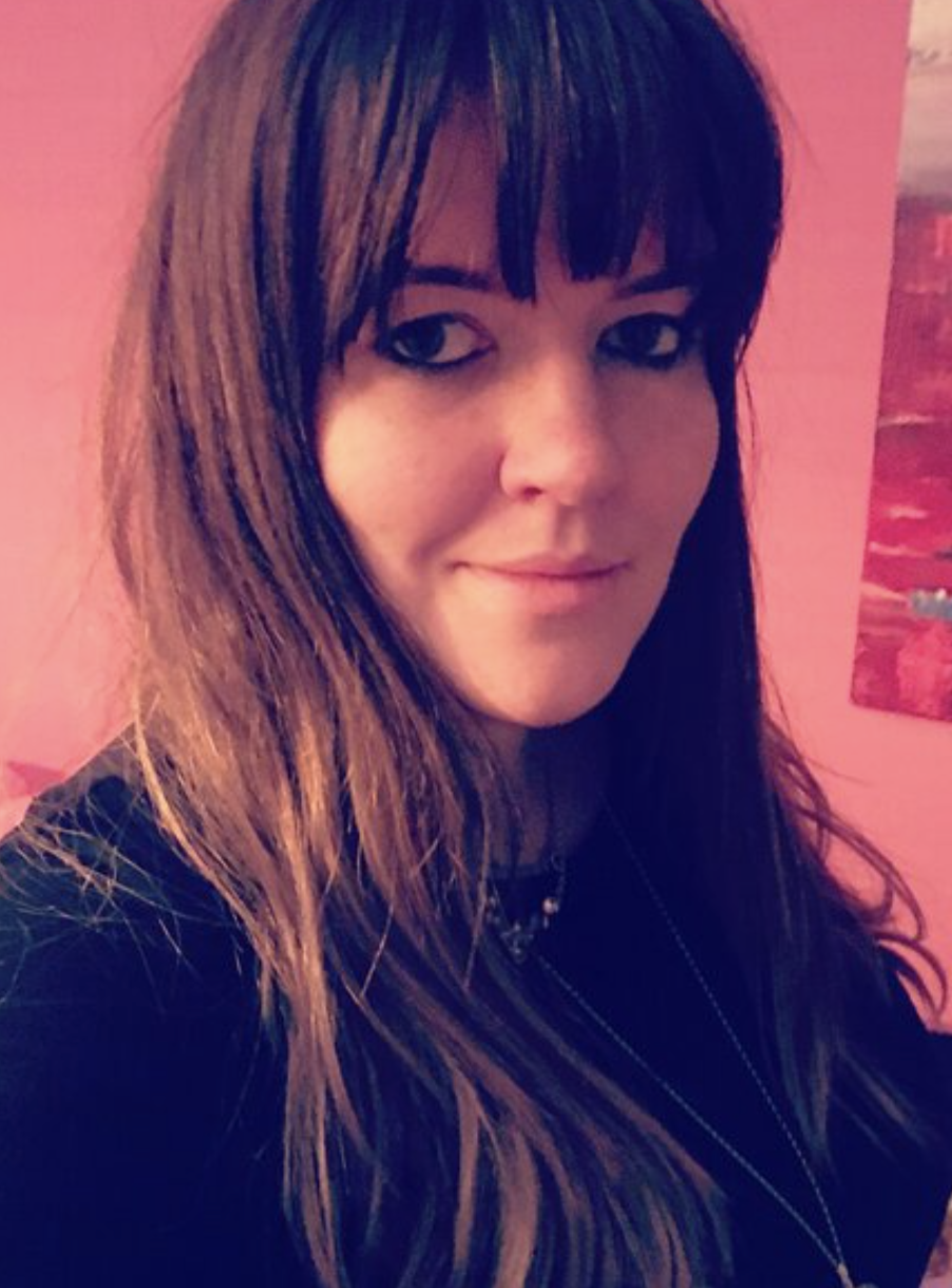 headshot of Elinor Rowlands, a person with long brown hair and a fringe